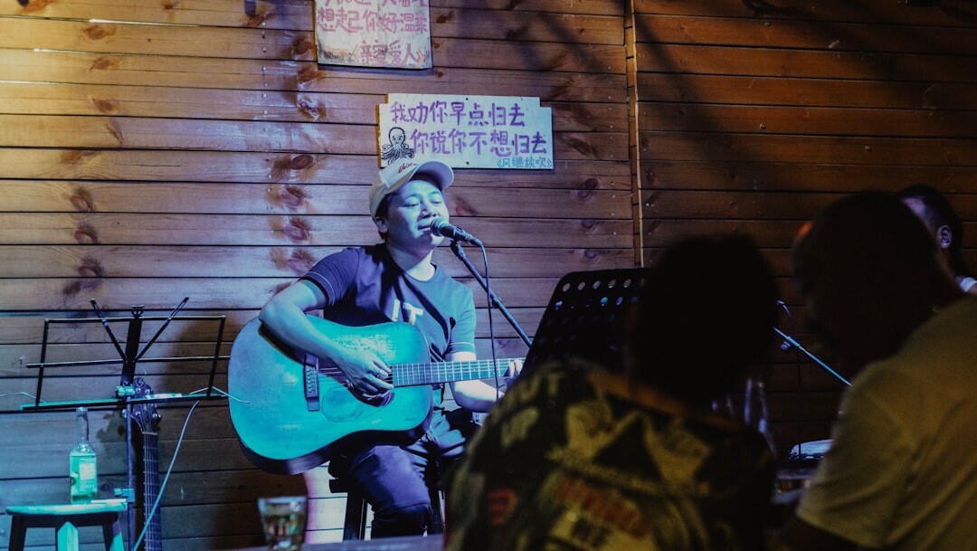 local musician on stage with guitar
